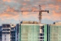 Under construction building with a crane on top and safety nets Royalty Free Stock Photo