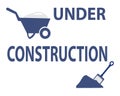 Under construction with cart and shovel sign