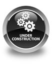 Under construction (gears icon) glossy black round button Royalty Free Stock Photo