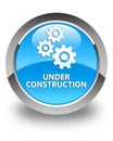 Under construction (gears icon) glossy cyan blue round button Royalty Free Stock Photo