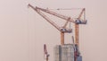 Under construction high-rise building with yellow construction crane in Dubai timelapse Royalty Free Stock Photo