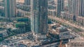 Under construction high-rise building with yellow construction crane in Dubai timelapse Royalty Free Stock Photo