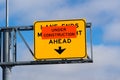 Under Construction `Lane Ends, Merge Right Ahead` sign posted on a freeway, California Royalty Free Stock Photo