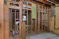 New home construction pipes and electrical unfinished basement under construction Royalty Free Stock Photo