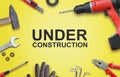 Under construction page with tools for home repairs Royalty Free Stock Photo