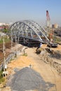 Under construction railway bridge over the railway tracks.