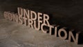Under Construction sign 3d illustration. Concrete letters on the wall. Royalty Free Stock Photo