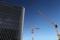 Under construction site building with crane and glass skyscraper Royalty Free Stock Photo