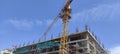 Under Construction Site with Crane and blue sky background Royalty Free Stock Photo