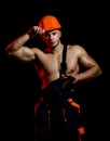 Under construction, it will appear soon. Man work with hammer. Hard worker use muscular strength. Construction worker Royalty Free Stock Photo