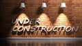 UNDER CONSTRUCTION write at red bricks wall - 3D rendering illustration Royalty Free Stock Photo