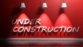 UNDER CONSTRUCTION write at red wall - 3D rendering illustration Royalty Free Stock Photo