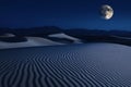 Under the enchanting glow of the moonlight, rippling sand dunes create a mesmerizing pattern across the desert landscape at night Royalty Free Stock Photo
