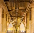 Under the glowing bridge at night