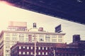 Under Manhattan Bridge, retro stylized Dumbo neighborhood, NYC. Royalty Free Stock Photo