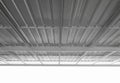 Under metal sheet roof corrugated metallic texture surface in new construction Royalty Free Stock Photo