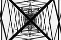 Under overhead high-voltage power line tower. View from bottom of construction Royalty Free Stock Photo