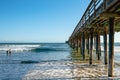 Avila Beach Pier, ocean waves, and blue sky Royalty Free Stock Photo