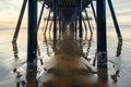 Under the pier. An old wooden Pismo Beach pier at sunset, CA