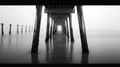 Under the pier perspective with waves crashing Royalty Free Stock Photo