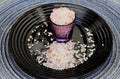 Portion of pink Himalayan salt in the small cup under the plate Royalty Free Stock Photo