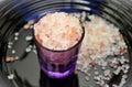 Under the plate a little purple cup with Pink Himalayan Salt Royalty Free Stock Photo