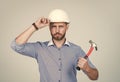 under protection. mature bearded businessman in helmet. confident guy hold hammer. Royalty Free Stock Photo