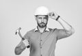 under protection. mature bearded businessman in helmet. confident guy hold hammer. Royalty Free Stock Photo