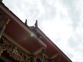 Under the roof of a Thai temple church On the background is the sky Royalty Free Stock Photo