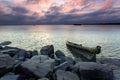 Under the rosy clouds were wooden sailboats and ro