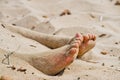Under the sun two feet out from the hot sand Royalty Free Stock Photo