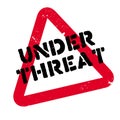 Under Threat rubber stamp