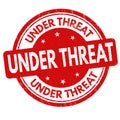 Under threat sign or stamp Royalty Free Stock Photo