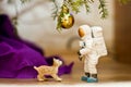 Under the tree. Lynx looking at an astronaut. Disco ball. Toy minifigures. Royalty Free Stock Photo