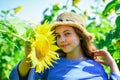 Under the weather. teen girl in sunflower field. concept of summer vacation. rich harvest and agriculture. happy Royalty Free Stock Photo