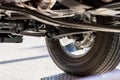 Underbody of an off-road vehicle , SUV or off-road vehicle shows automotive engineering in detail with wheel suspension, exhaust