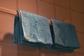 Underexposed of the blue towel on the bathroom hanger Royalty Free Stock Photo