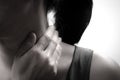 Underexposure of closeup women neck and shoulder pain/injury with red highlights on pain area with white backgrounds