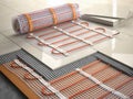 Underfloor heating installation concept. Mat elecric heating system with ceramic tiles and cement layers