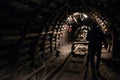 Underground black coal mine with rail tracks Royalty Free Stock Photo