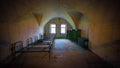 Underground bunker barracks with beds and Windows with bars Royalty Free Stock Photo