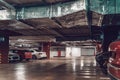 Underground car parking garage in modern mall with cars Royalty Free Stock Photo