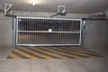 Underground cement car park garage parking entry door gate empty without cars