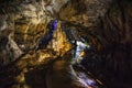 Underground creepy tunnel in dark cave or limestone grotto, speleology nature corridor in Adygeya mountains