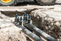 Underground district heating pipeline reparation and reconstruction on the street in the city old ones replacement with new pipes Royalty Free Stock Photo