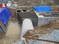 Underground drainage manhole under construction by construction workers at the construction site. Royalty Free Stock Photo