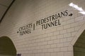 Underground entrance to cyclist and pedestrian tunnels showing information signs and tiled interior