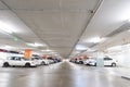 Underground interior garage parking lot with many cars. Royalty Free Stock Photo