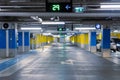 Underground parking lot with many cars, no people Royalty Free Stock Photo