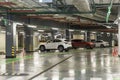 Underground parking in a shopping center with cars. Entertainment and business Royalty Free Stock Photo